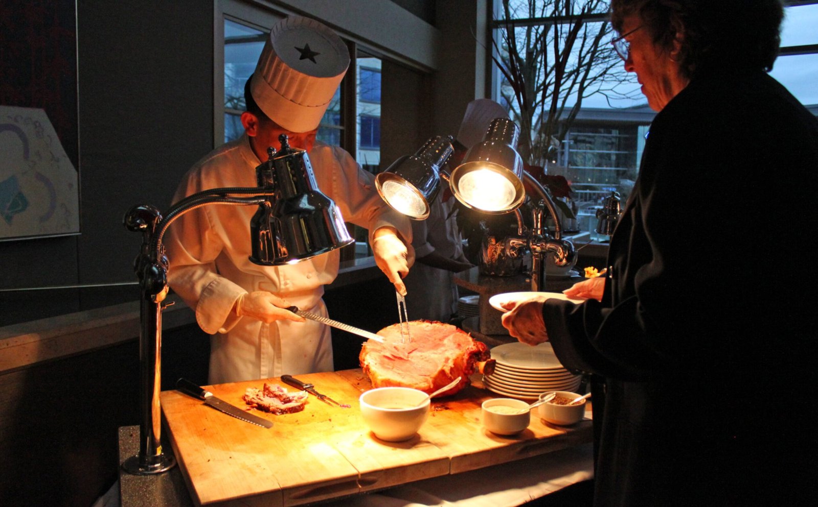 Stainless steel thermal carafe on a breakfast table by the sea
